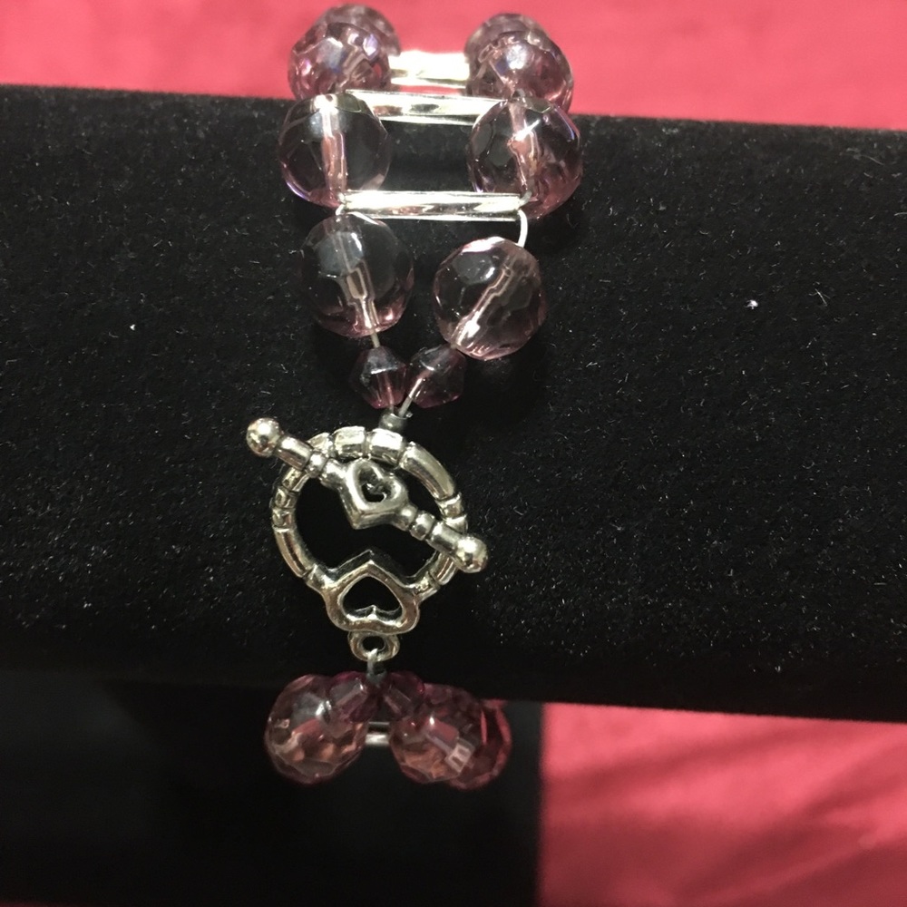 Adorable purple bracelet.  Bracelet measures 7”
